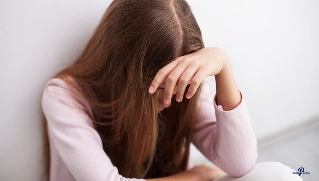Teenage girl sitting suffering from anxiety How To Help A Teenager With Anxiety