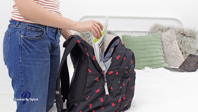 Teen filling a bag with quite time activities like books