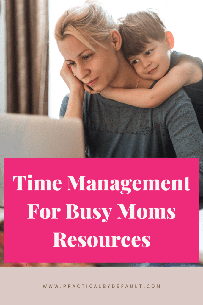 mom working on a computer with boy hugging her. Time management for busy moms resources