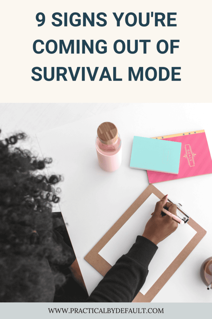 woman writing on a sheet, signs you are coming out of survival mode 