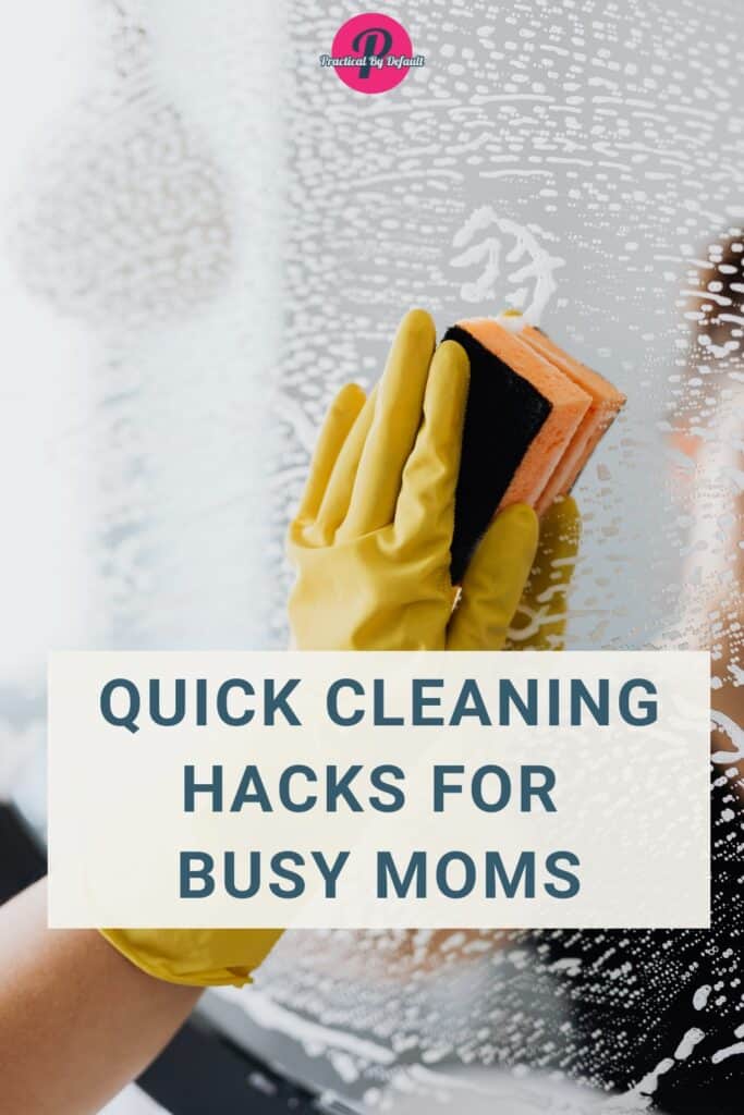 "A gloved hand cleaning a mirror with a sponge, featuring the text 'Quick Cleaning Hacks for Busy Moms' by Practical By Default."